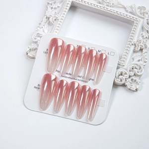 Pink chrome gradient press-on nails in long coffin shape on a display card