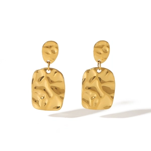 Detail of 18K gold stainless steel earrings with hammered texture and square pendant