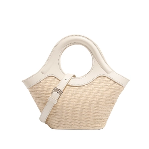 Chic woven straw handbag with cream leather trim and adjustable crossbody strap