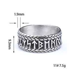 Macro view of Nordic Viking ring showing Runic carvings and woven texture edges