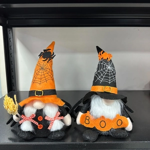 Detail of Halloween gnome dolls featuring spiders, orange hats, and a BOO sign prop