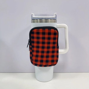 Detail of red and black plaid zipper pouch attached to a white 40oz tumbler handle