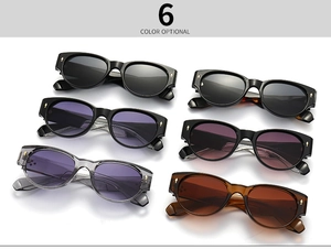 Flat lay of retro round sunglasses in six various colors including amber and purple