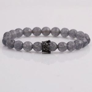 8mm gray matte beaded bracelet with a black crown charm and reflective background