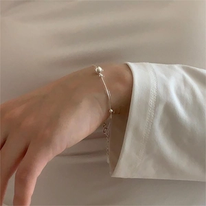 Minimalist S925 sterling silver beaded snake chain bracelet worn on a female wrist