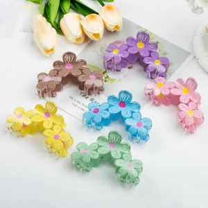 Set of six colorful graffiti flower hair claws in pastel shades for elegant updos