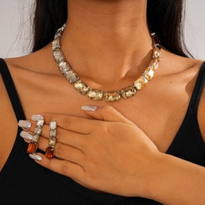 Macro detail of luxury vintage crystal jewelry set with sparkling geometric square pendants