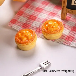Macro shot of 2cm miniature resin mango tart with realistic texture and dimensions