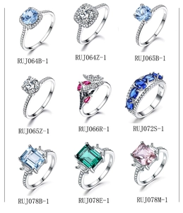 Macro display of 925 sterling silver rings with colorful gemstones in various shapes