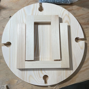 Close-up of portable wooden wine table parts featuring four glass slots and clear texture