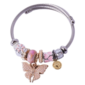 Silver twisted wire bracelet featuring pink charms and a large pearl butterfly pendant