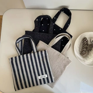 Three canvas mini tote bags featuring stripes, solid color, and polka dot patterns