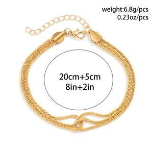Detail of layered gold textured chain necklace with lobster clasp and extension link