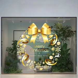 Golden Christmas wreath window decal with Merry Christmas text on glass surface