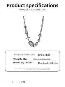 Close-up of silver Y2K butterfly necklace with rhinestones and oval pendant details