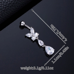 Macro view of silver butterfly navel ring with cubic zirconia showing 4.4cm length detail