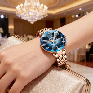 Close-up of DEDIMA watch with gradient blue faceted glass dial and rose gold steel strap