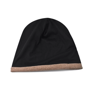 Detail of two-tone knitted beanie with black crown and textured brown cuff fabric