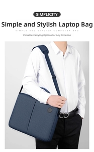 Close-up of dark blue laptop bag featuring textured fabric and wide shoulder strap