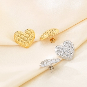 Quilted gold and silver heart earrings made of stainless steel on elegant silk