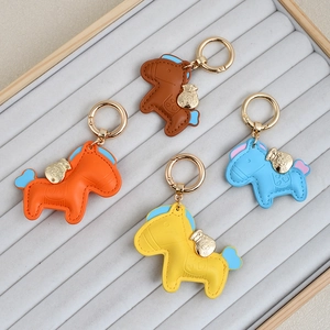 Creative faux leather horse keychain charm in four colors with gold lucky bag pendant