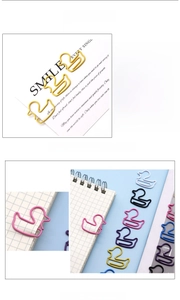 Close-up of duck-shaped colorful paper clips made of durable coated metal wire