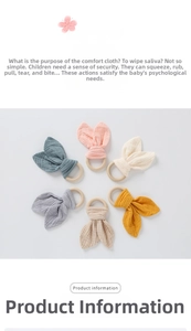 Detail of wooden teether ring with soft cotton rabbit ears in multiple colors