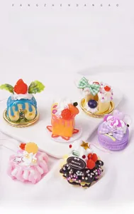 Collection of six realistic PVC mini cake charms with colorful icing and strawberry details