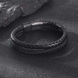 Detail of double-layer black braided leather bracelet with matte black magnetic clasp