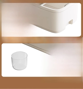 Detail of rice container showing a hidden handle and a clear measuring cup for easy use