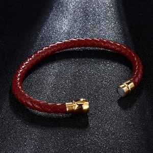 Men's minimalist red braided leather bracelet featuring a golden magnetic metal clasp