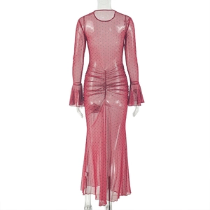 Detail of burgundy ruched polka dot mesh dress with long sleeves and fishtail hemline