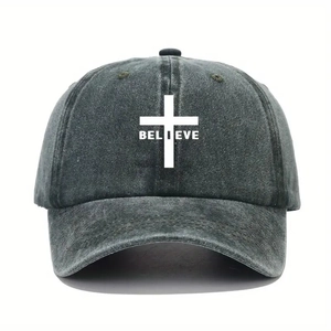 Close-up of BELIEVE text and cross print on washed dark gray cotton baseball cap