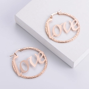 Rose gold titanium steel earrings with LOVE inscription and textured round frame