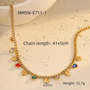 Detail of gold fringe necklace with multi-colored heart stones and dimension labels
