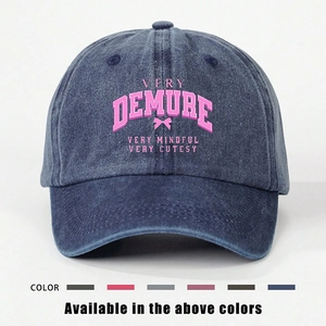 Navy washed denim baseball cap with pink Very Demure print and bow detail