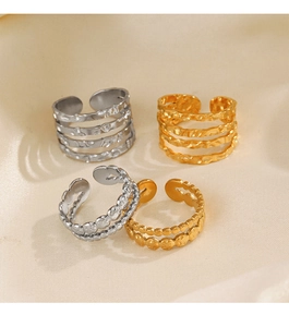 Detail of adjustable stainless steel rings with hammer pattern and beaded design set