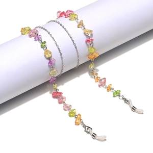Detail view of colorful natural stone chain with silver metal links for glasses