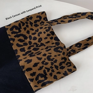 Detail of leopard print fabric stitched with black canvas on a large tote bag