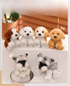 Detailed view of six miniature plush dog keychains including Golden Retriever and Schnauzer