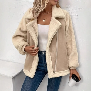 Detail of faux shearling collar and suede contrast stitching on a beige biker jacket
