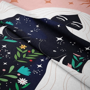 Detailed view of bohemian tapestry fabric showing plush texture and artistic moon pattern