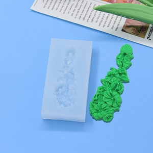 Floral silicone mold for baking cakes featuring detailed flower and leaf relief patterns