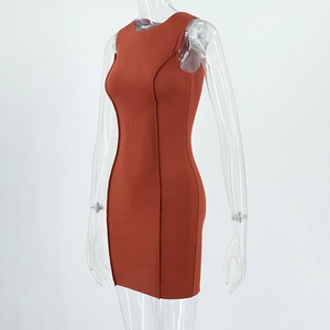 Detail of brick red sleeveless dress showing ribbed texture and exposed seam lines