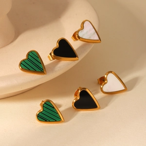 Detail of heart earrings in green stripes, black gloss, and white shell with gold edges