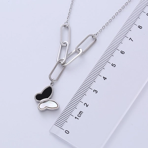 Measuring black and white butterfly pendant necklace showing a width of approximately 2cm