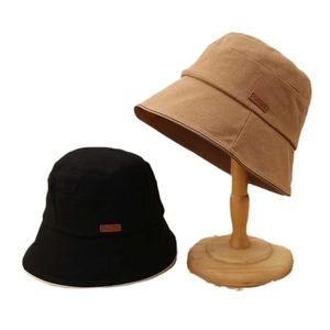 Classic cotton canvas bucket hat in black and khaki colors with wide sun protection brim
