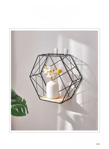 Detail of Nordic hexagonal wall shelf with black metal frame and wooden base