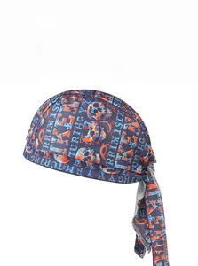 Close-up of lightweight quick-dry pirate hat with orange and blue skull pattern