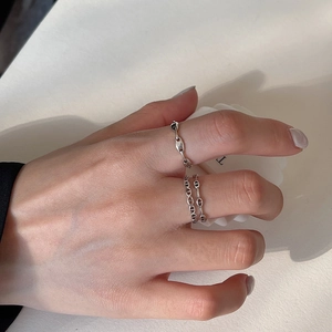 Detail view of 925 sterling silver rings featuring a minimalist link chain design for women
